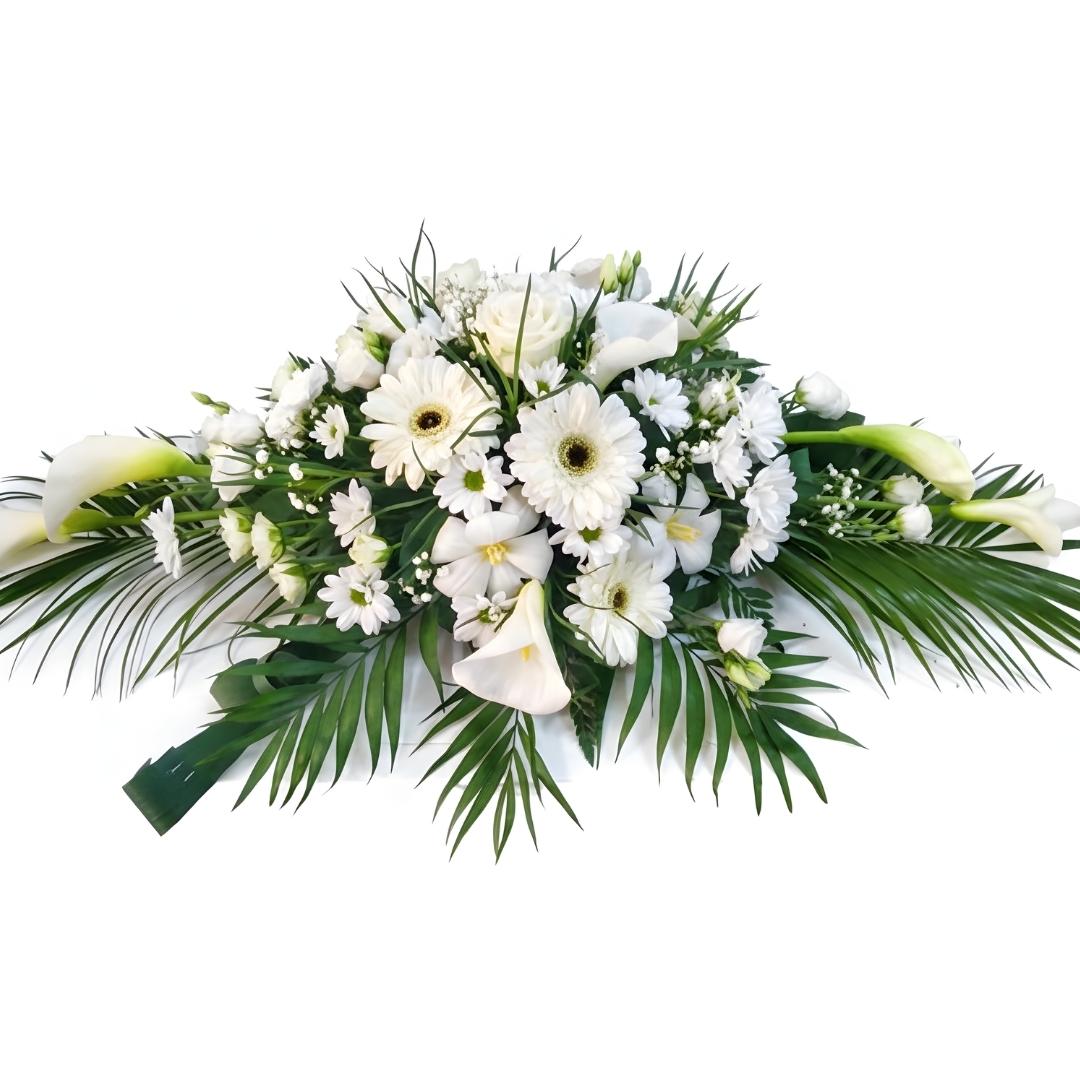 Floral arrangement with white flowers and green leaves on a white background