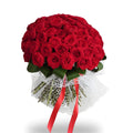 Bouquet of red roses with green ribbons on a white background