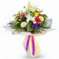 Bouquet of flowers with a pink ribbon on a white background