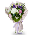 Bouquet of flowers wrapped in paper with a ribbon on a white background