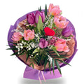 Bouquet of flowers with pink tulips, purple tulips, and a red heart on a white background