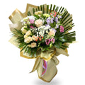 Bouquet of flowers with greenery and ribbons on a white background