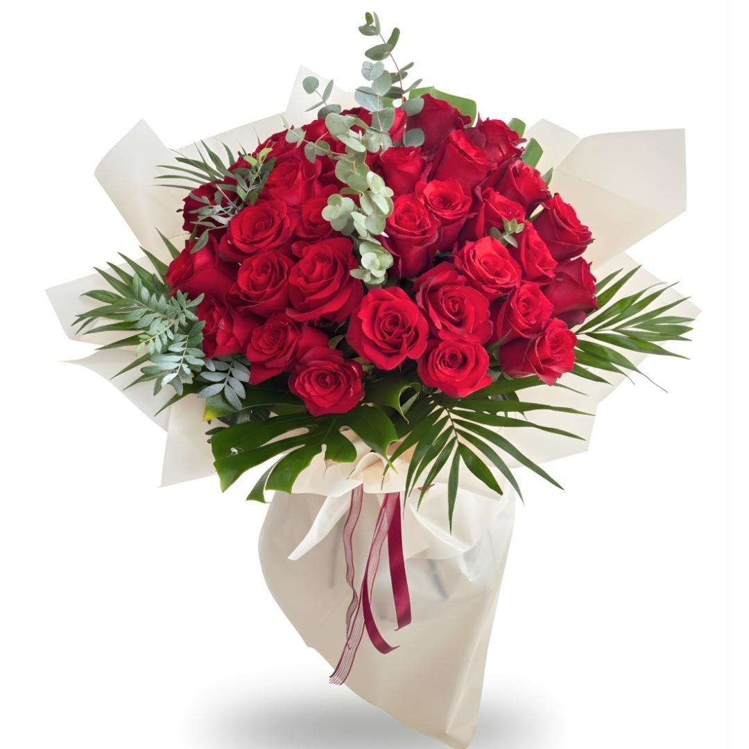 Bouquet of red roses with greenery on a white background