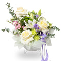 Bouquet of flowers with white, yellow, and purple flowers on a white background