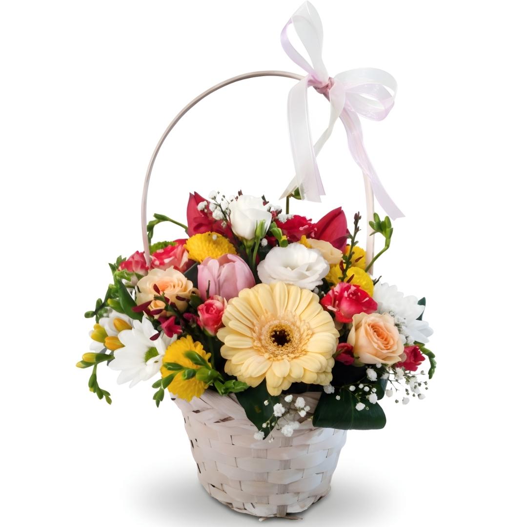 Floral arrangement in a basket with a white ribbon on a white background