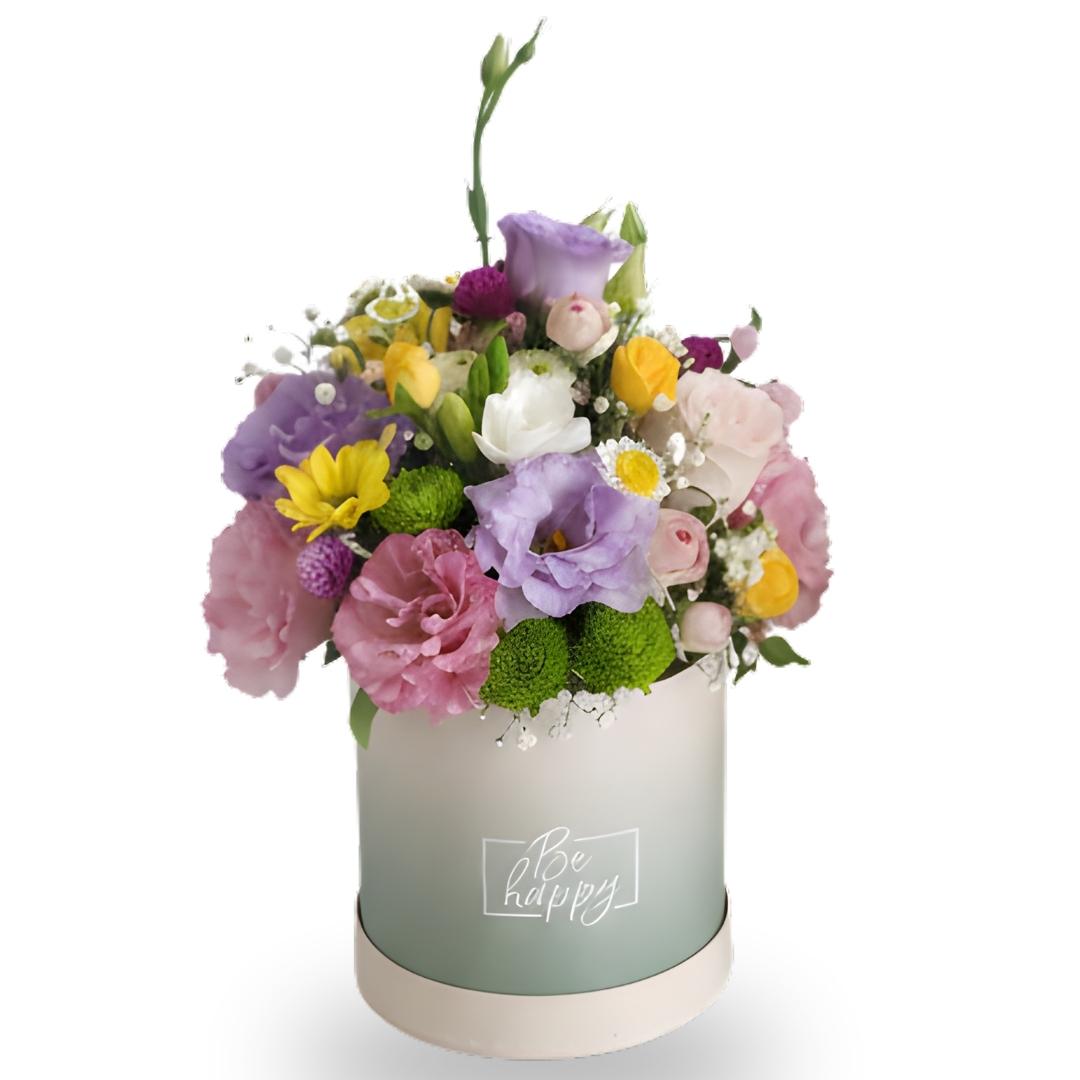Colorful flower arrangement in a box with 'Be happy' text on a white background