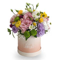 Colorful bouquet of flowers in a white box with 'Be happy' text on a white background