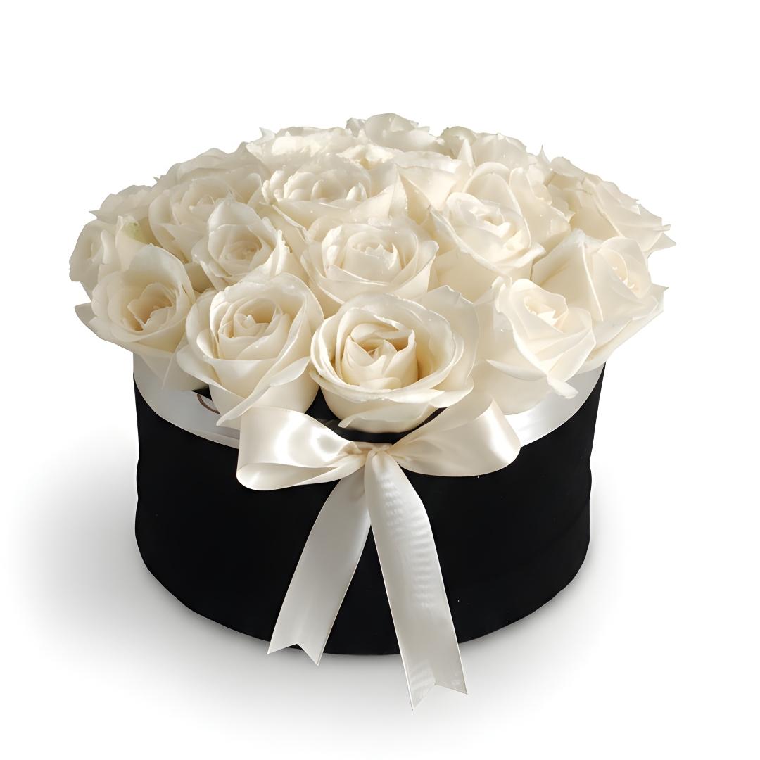 Black box with white roses and a white ribbon on a white background